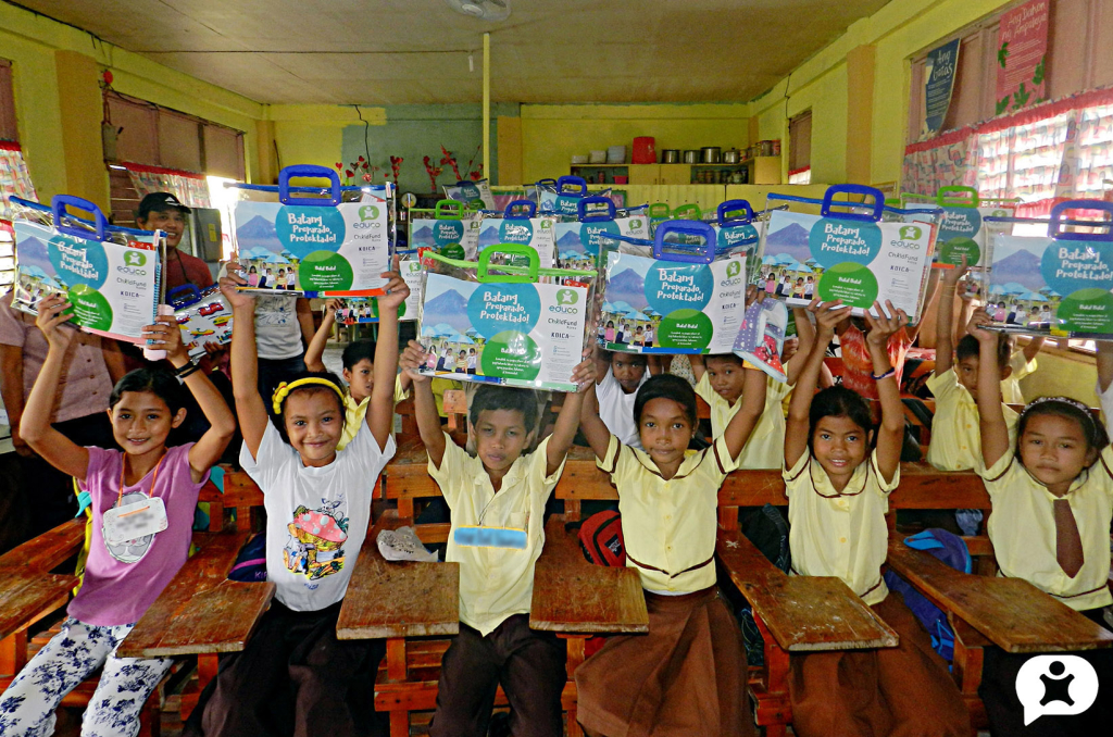 Pupils of Atipolo Elementary School show off new school supplies from Educo. Photo taken 7 June 2017 in Bato, Camarines Sur. 